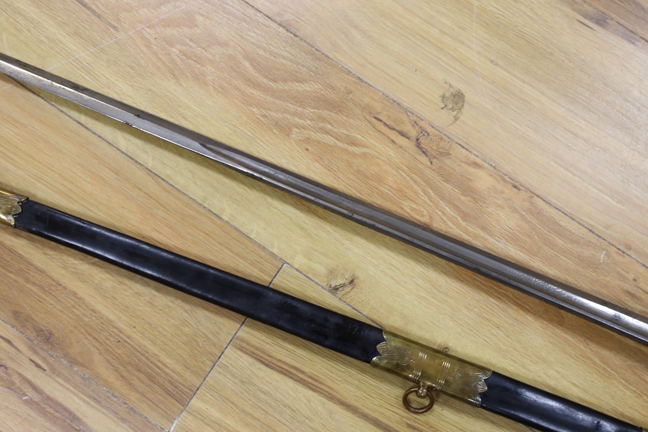A George V naval officers sword, made by Friedeberg Portsea, serial number 4351 stamped to spine